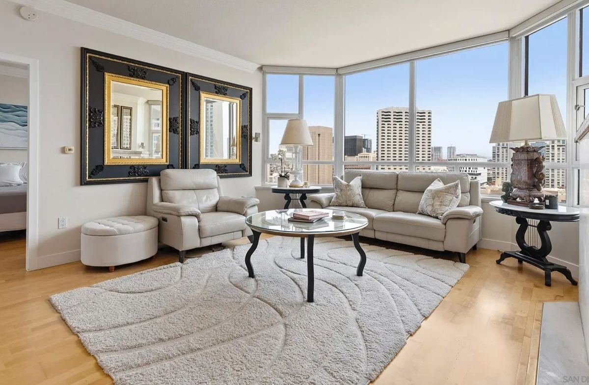 Bright condo living room with city views